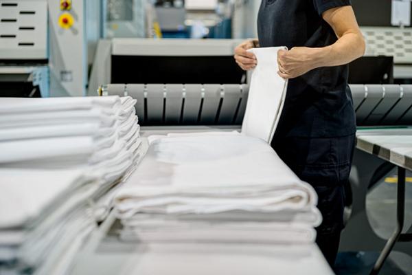 woman folding sheets